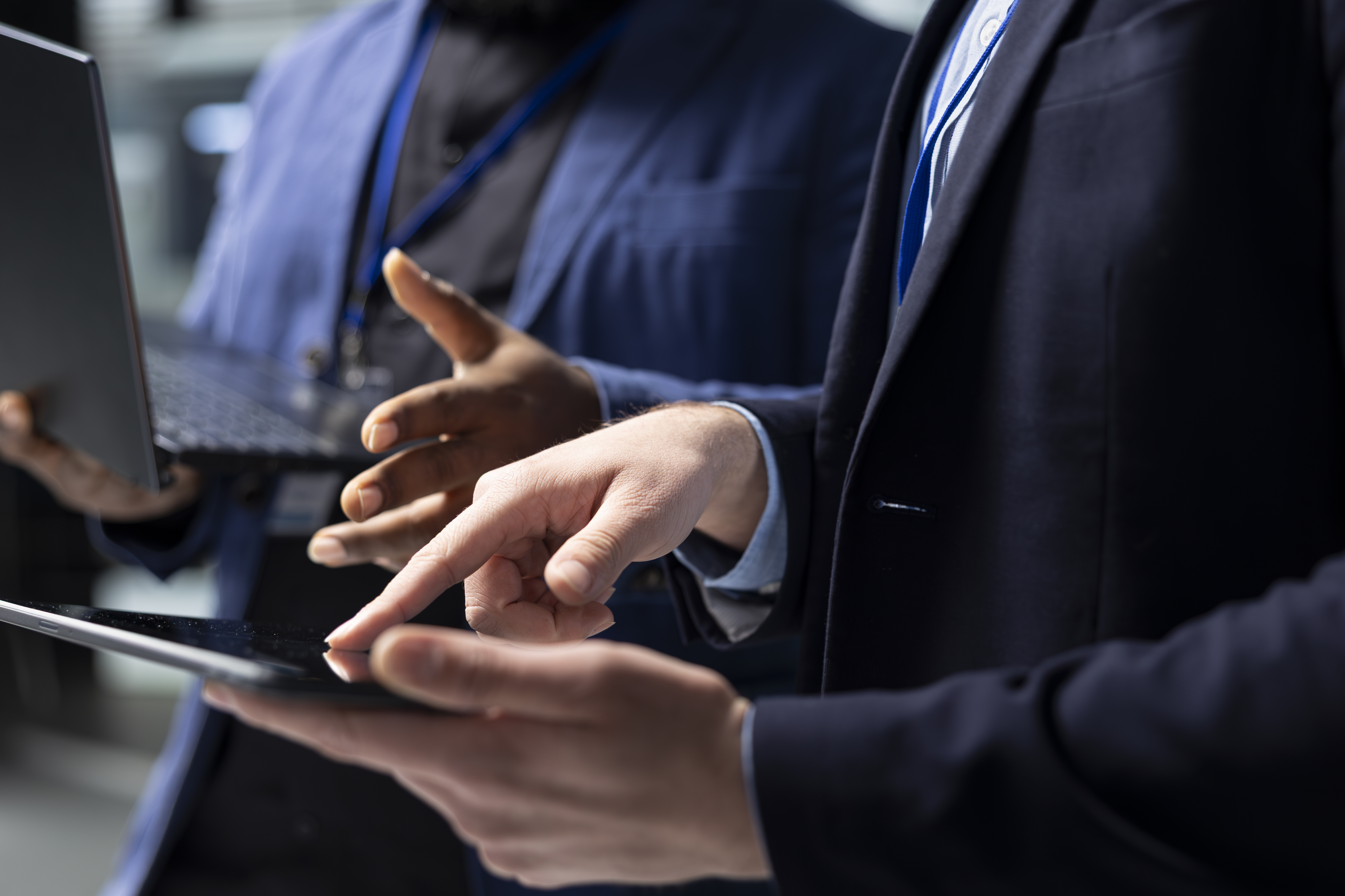 multiethnic-technicians-building-contractors-group-analyzing-data