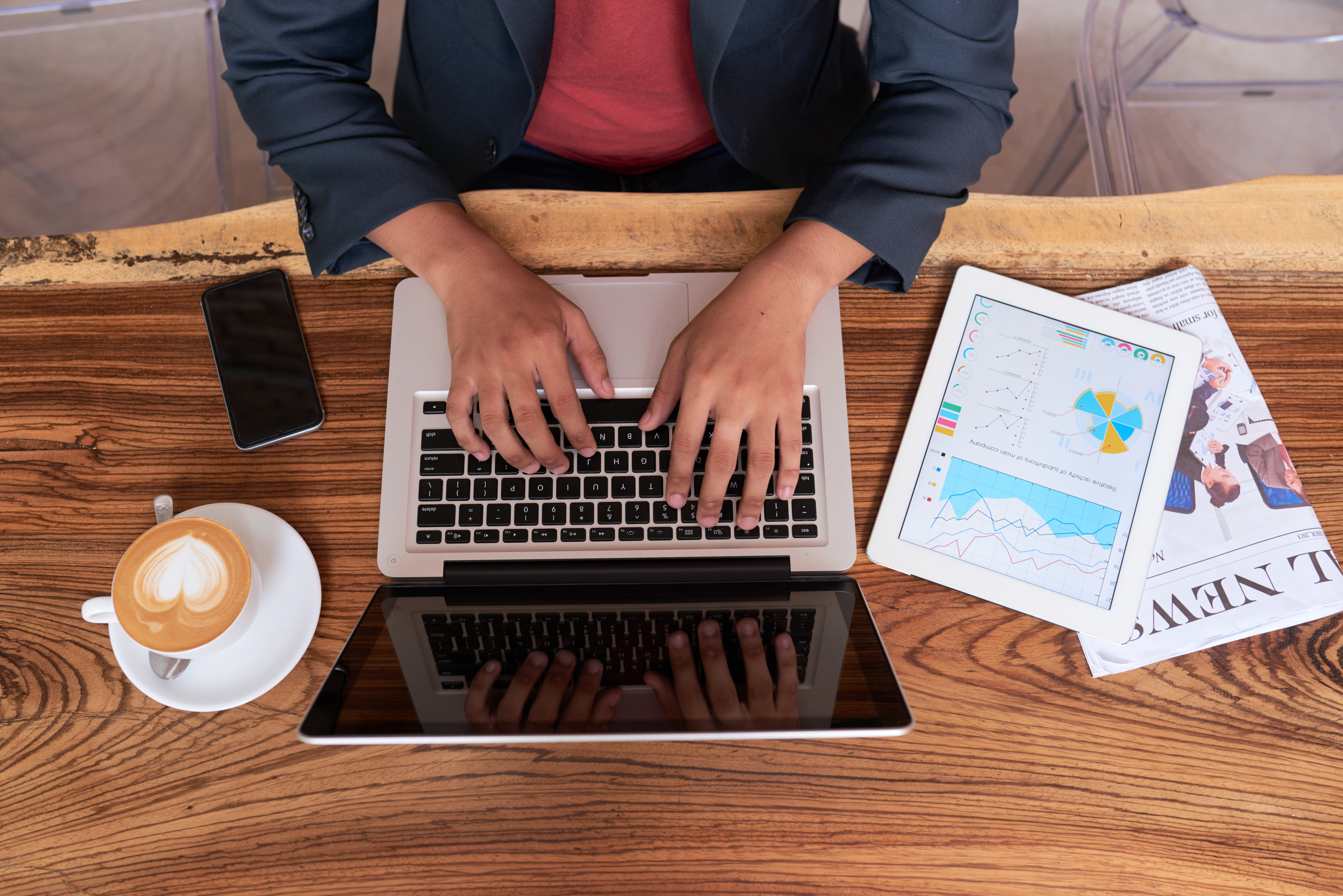 hands-unrecognizable-man-sitting-wooden-table-cafe-working-laptop