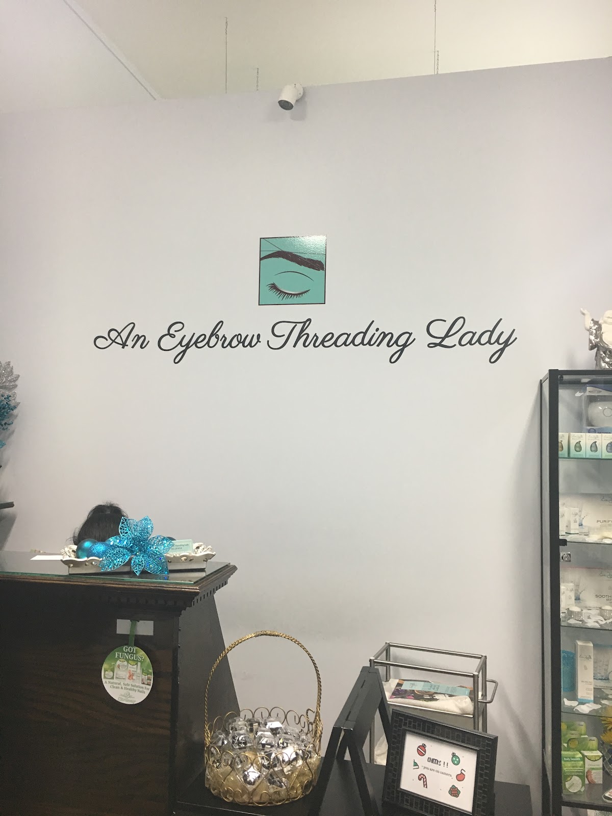 An Eyebrow Threading Lady